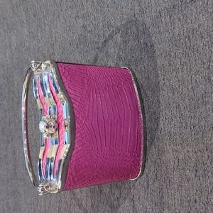 Mini hard shell hand bag.